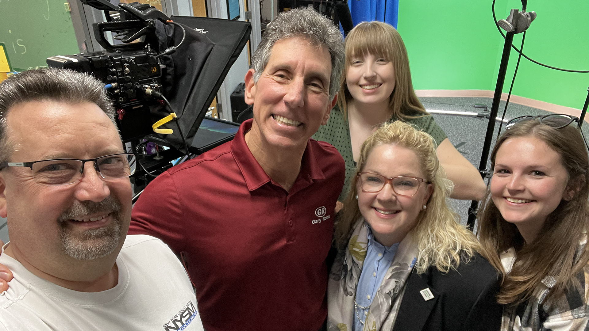 NYSM crew and client team smiling together on set