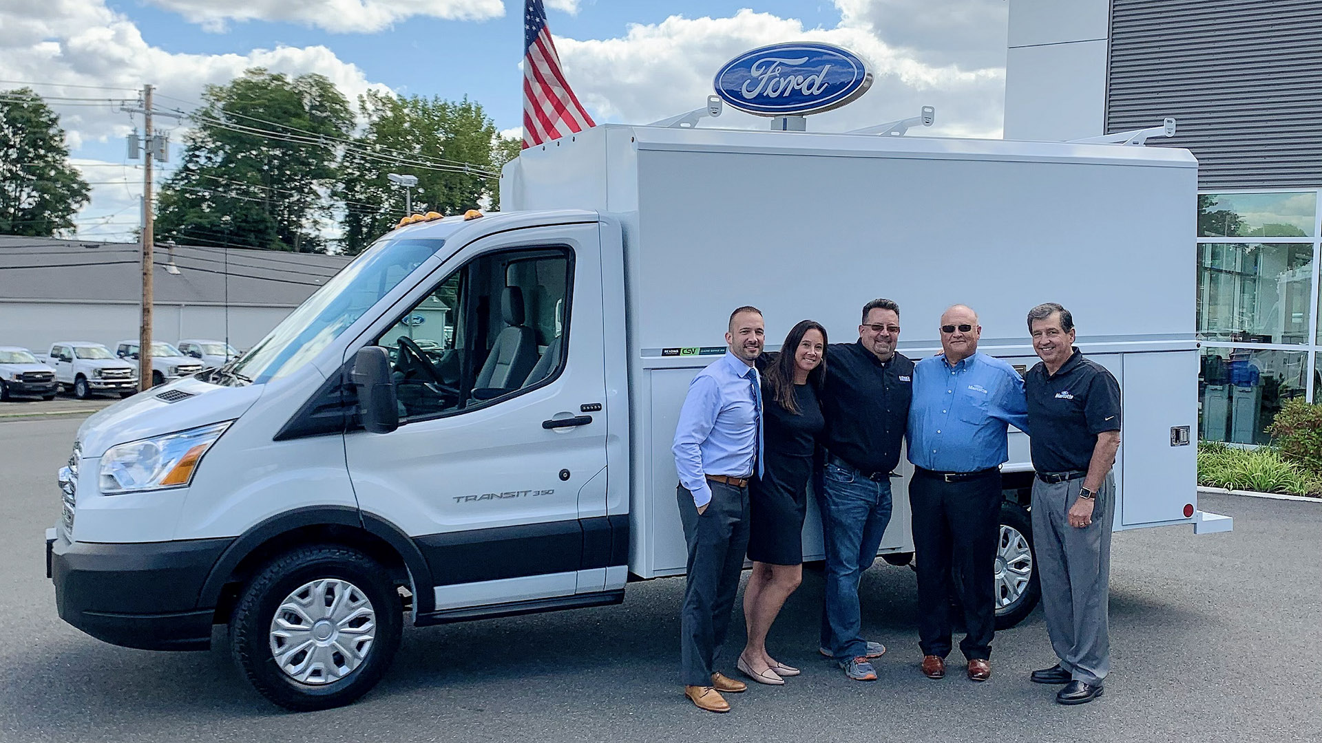 NYSM with the Marcotte Ford team beside a commercial vehicle